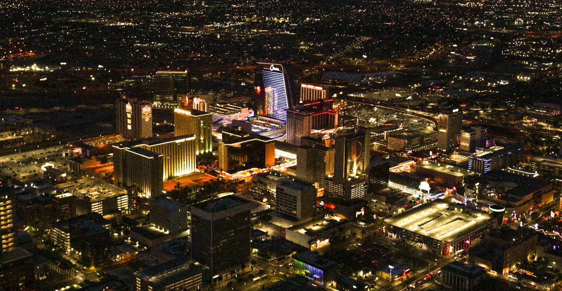 Historic downtown Las Vegas captured from the sky, featuring iconic landmarks and neon glow